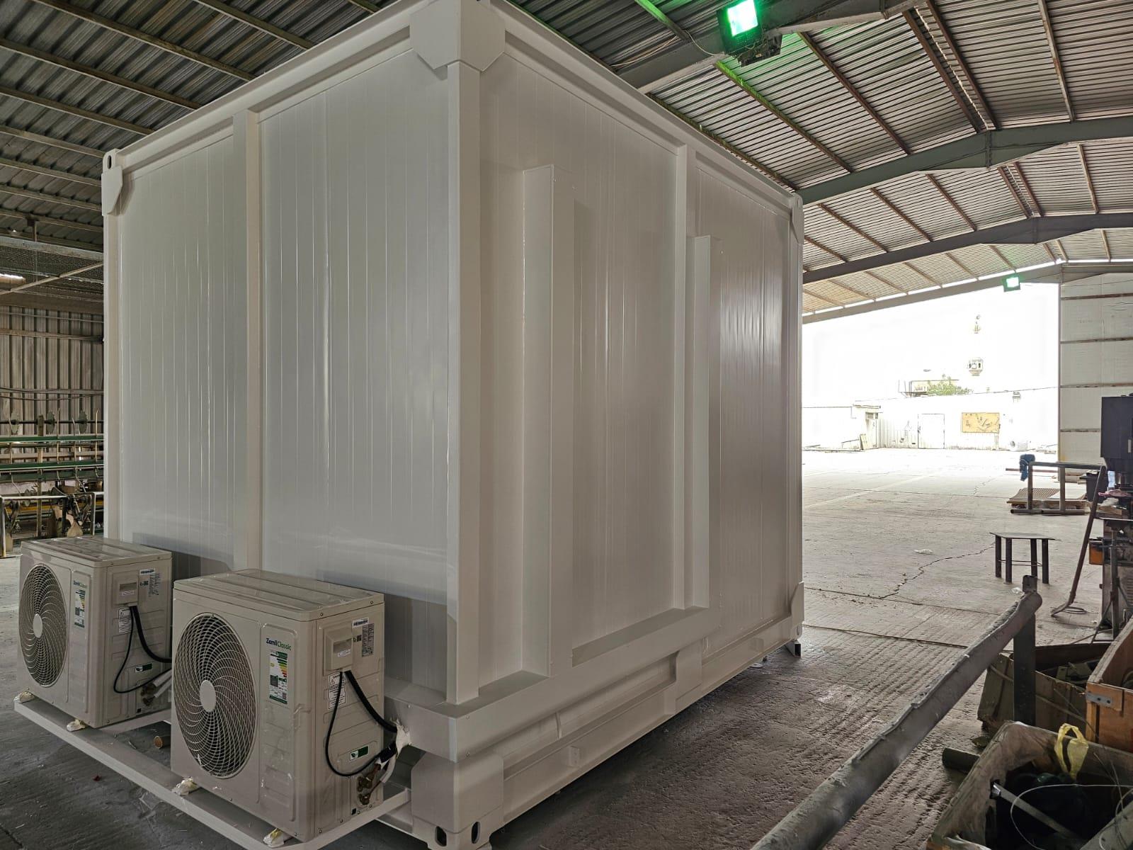 Container shelter with twin external air conditioners